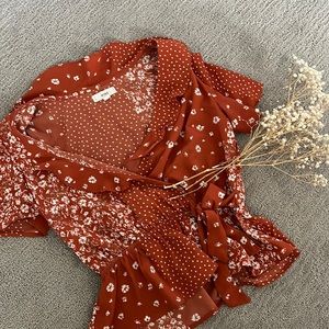 patterned orange blouse